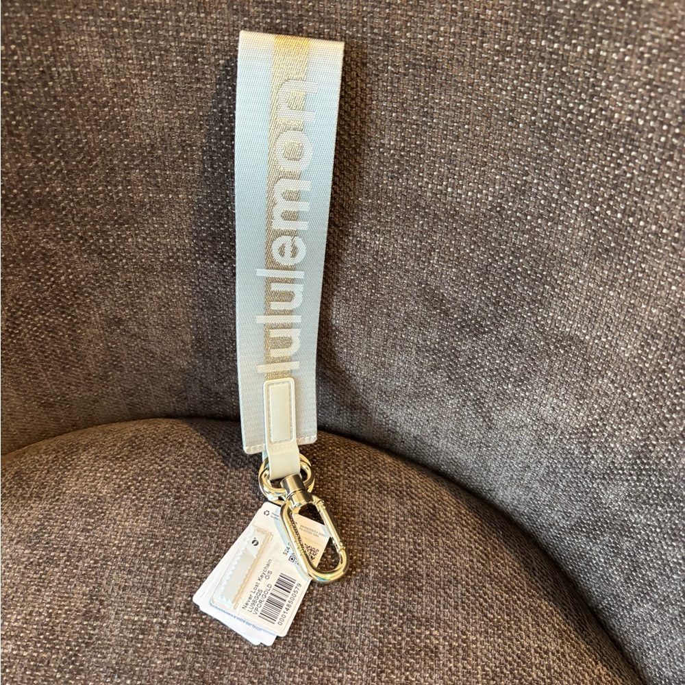 Lululemon Light Gray Keychain with Gold Carabiner -NWT